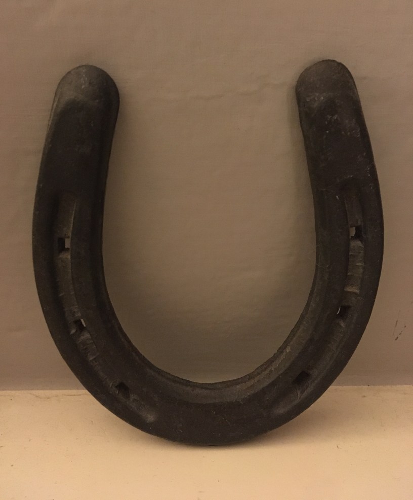 A metal horseshoe in a U-shape.