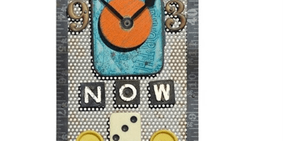 An artsy clock shaped like a house has a red triangle roof with a rusty old-fashioned key in the middle and tape measure outlining the rectangular house. The house has the clock element with a metal 9 and 3. Below that is the word “now.” Underneath that is a domino flanked by two buttons and under that is the word “then.” At the bottom is a black and white photograph of the Beatles from the 1960s.