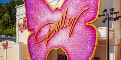 Pink butterfly with the name Dolly in gold at Dollywood theme park to represent Dolly Parton
