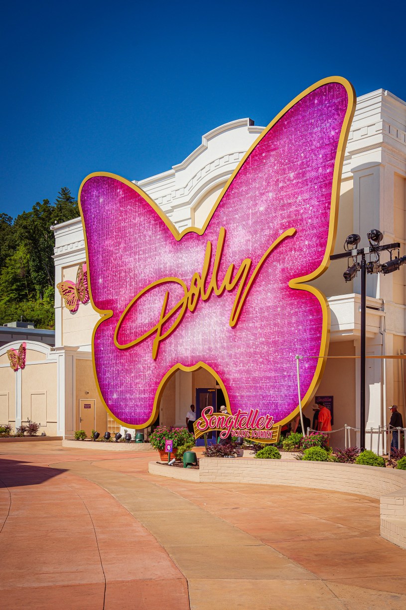 Pink butterfly with the name Dolly in gold at Dollywood theme park to represent Dolly Parton